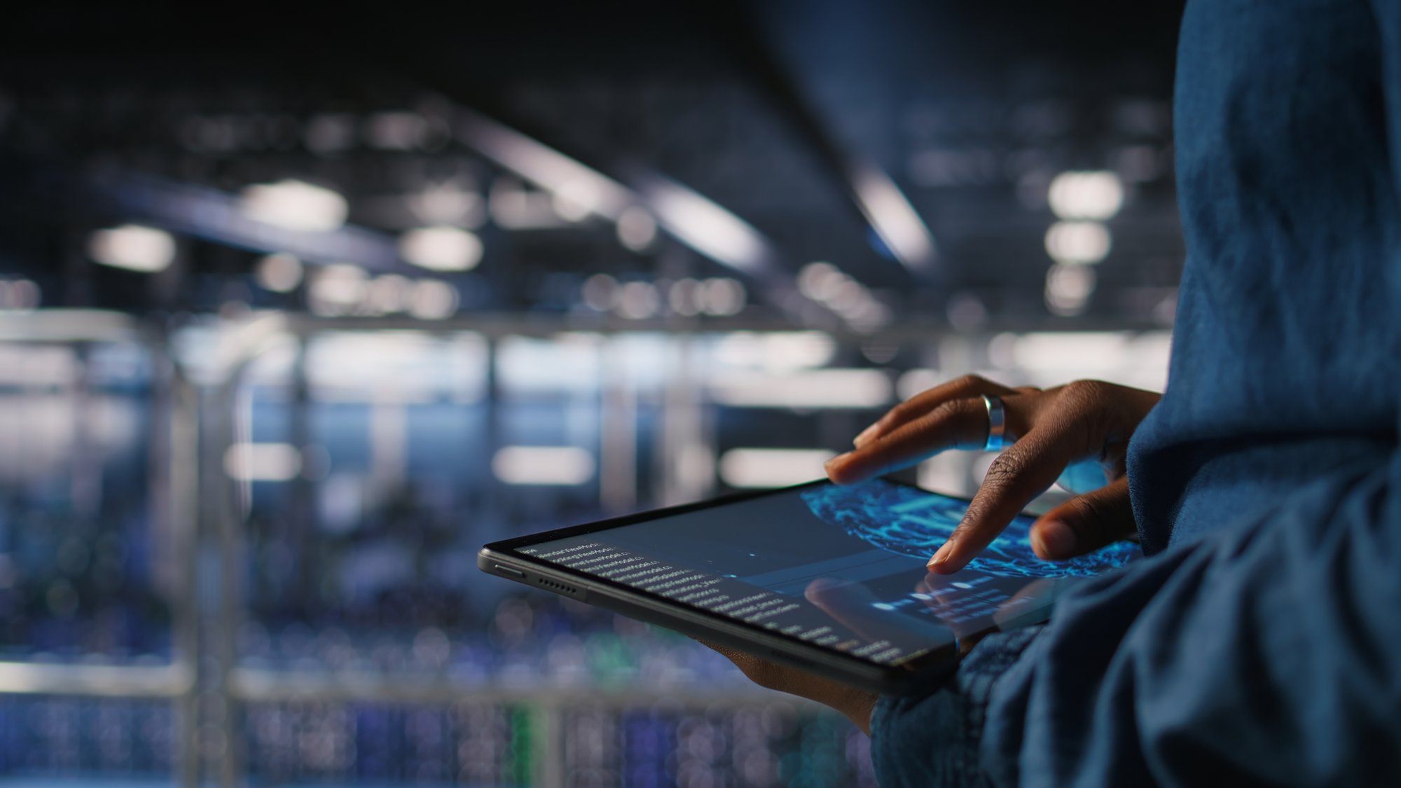 close-up-data-center-engineer-using-tablet-doing-maintenance-ai-rigs
