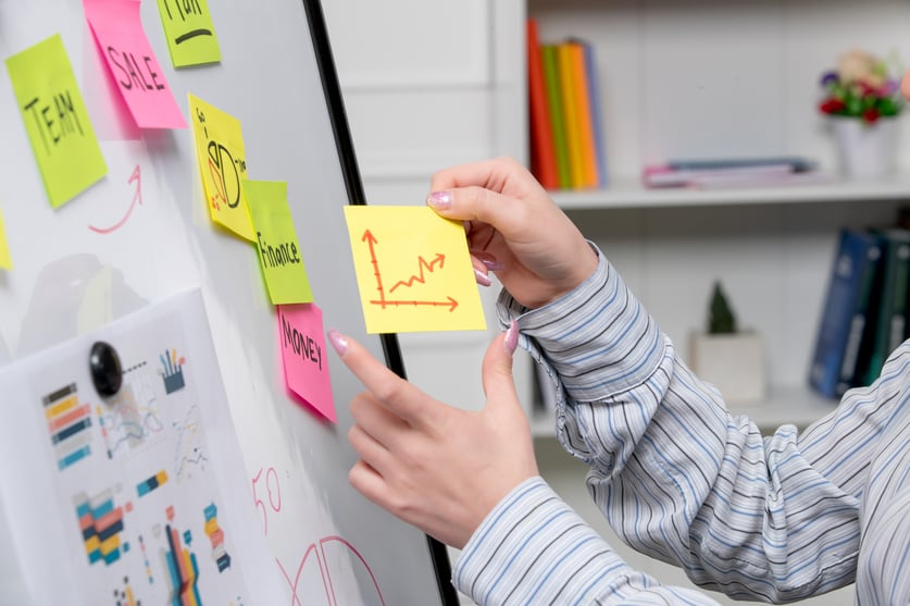marketing-young-cute-business-lady-striped-shirt-office-showing-raising-results